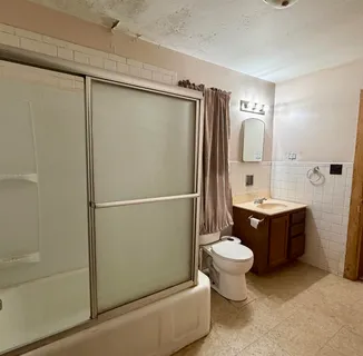 a bathroom with a sink and toilet