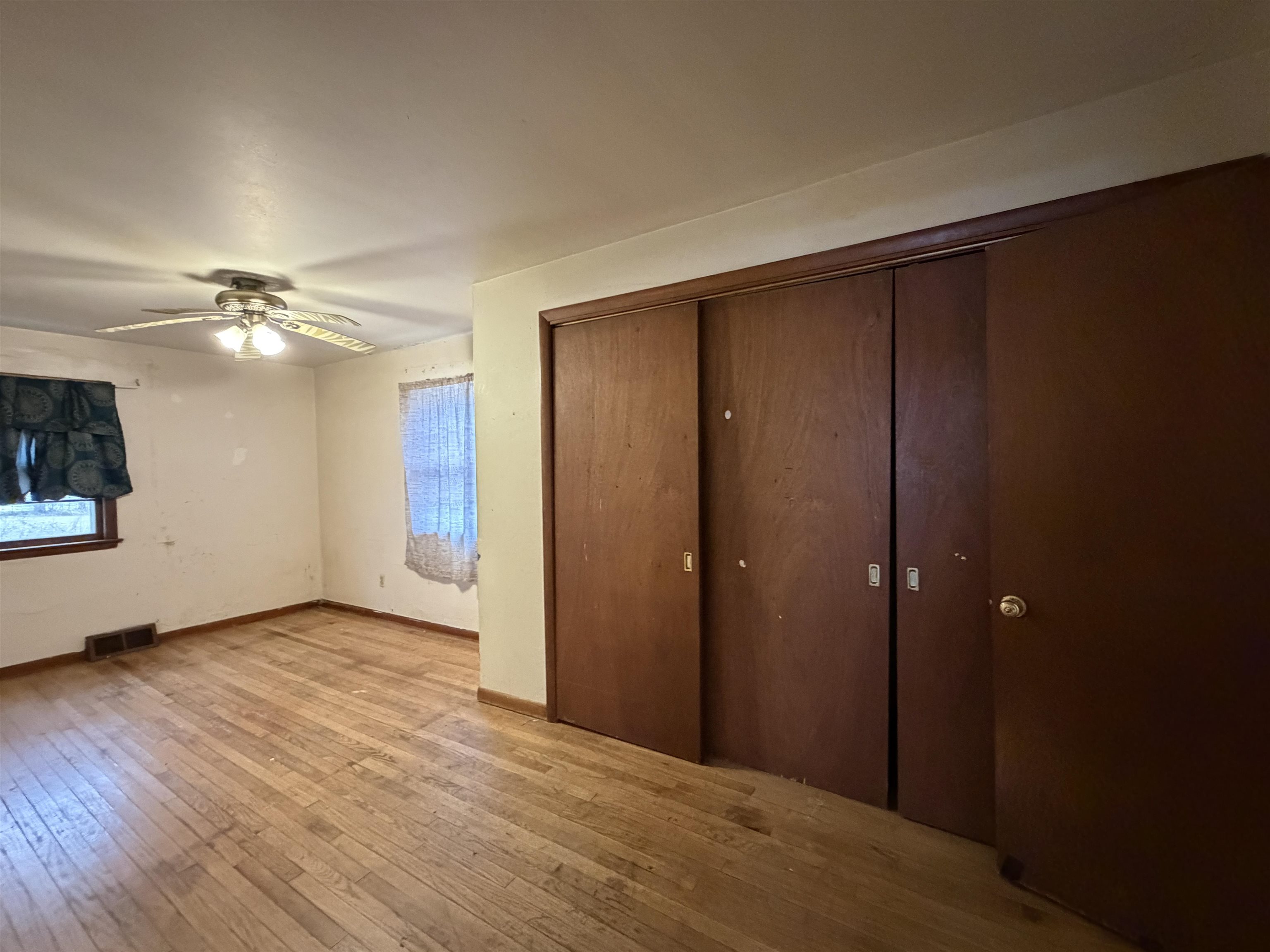 3517 North Henderson Road Freeport, IL 61032 - Photo 20 of 26 a view of an empty room with wooden floor