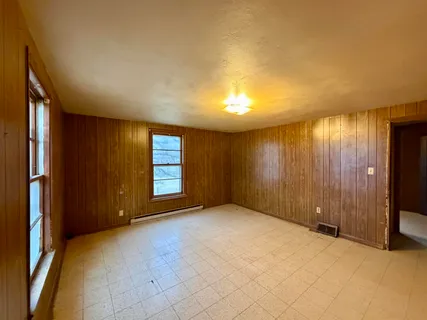 an empty room with windows