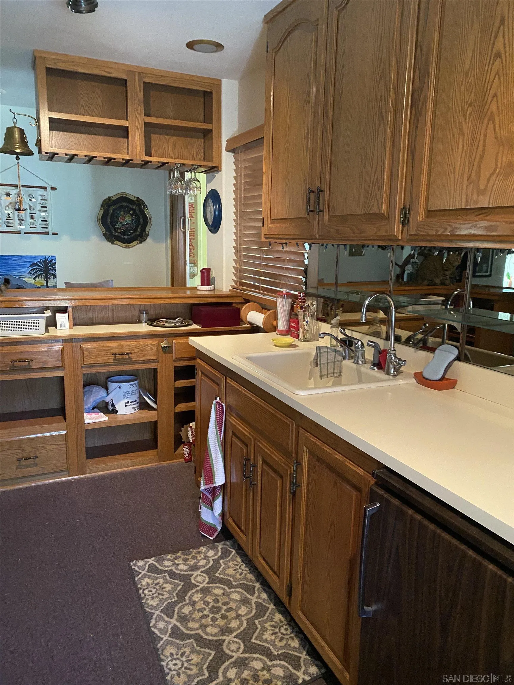 1335 Sunny Heights Road Fallbrook, CA 92028 - Photo 6 of 9 a kitchen with kitchen island a stove a sink and a microwave