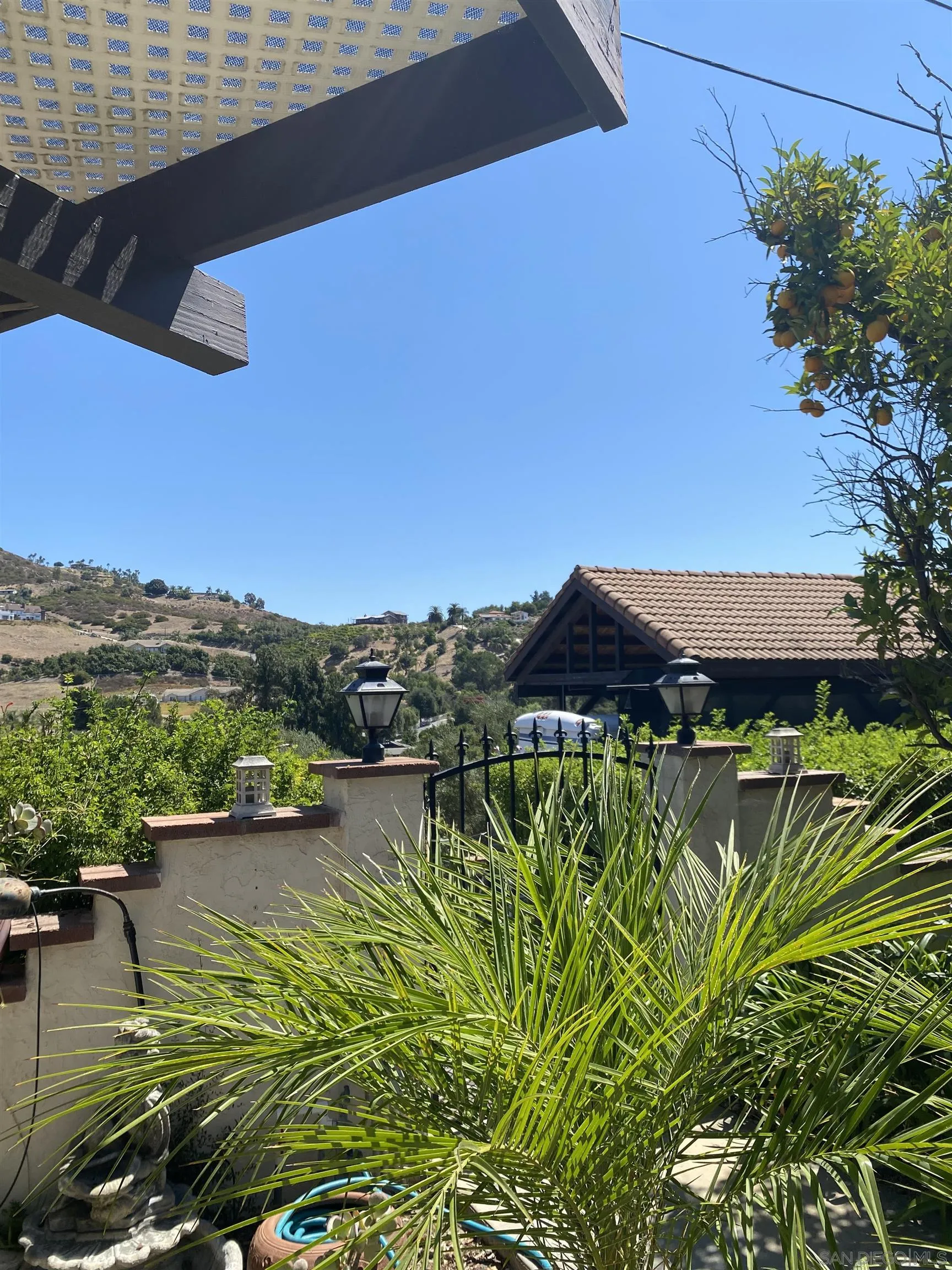 1335 Sunny Heights Road Fallbrook, CA 92028 - Photo 7 of 9 a view of a lake with a house in the background