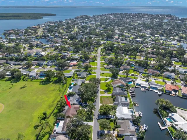 an aerial view of a houses with a yard