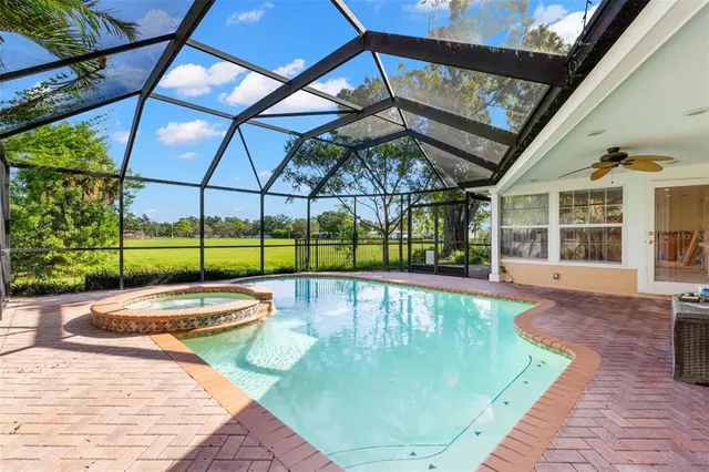 a view of swimming pool with a patio