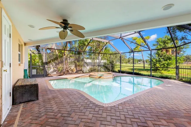 a view of swimming pool with seating space