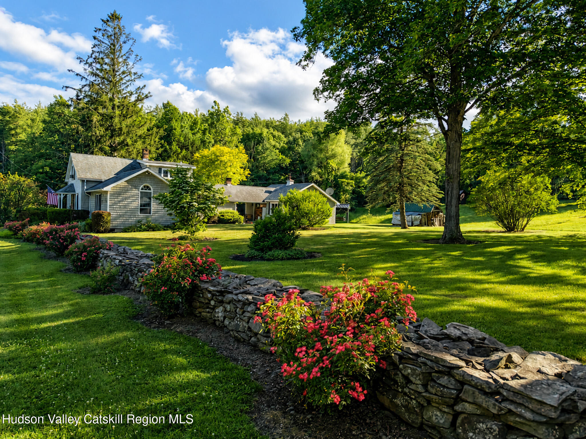 221 Camp Medusa Road Rensselaerville, NY 12120 - Photo 53 of 57 a view of a house with a big yard and potted plants