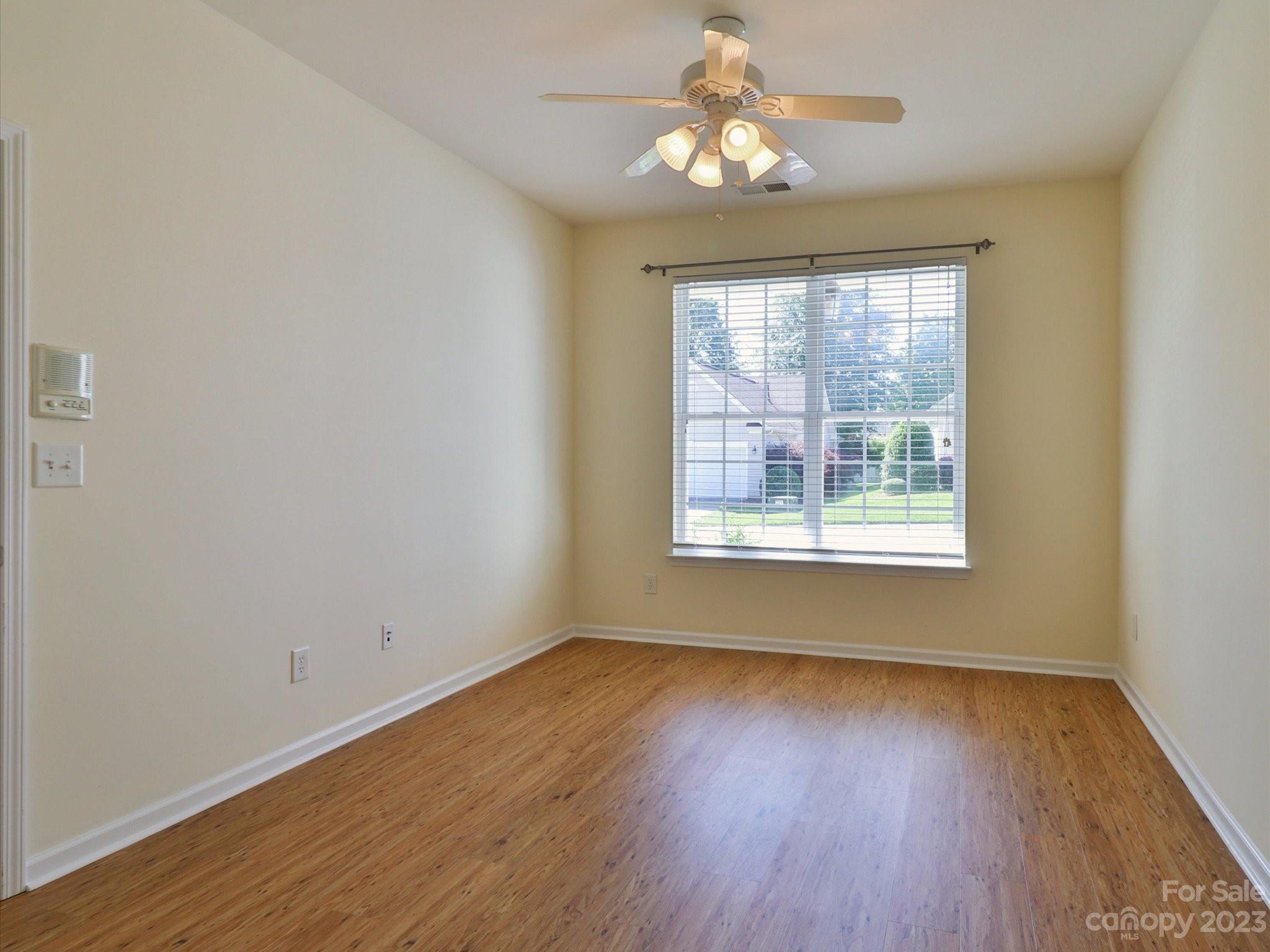 838 Platinum Drive Fort Mill, SC 29708 - Photo 27 of 48 a view of wooden floor and a chandelier in a room