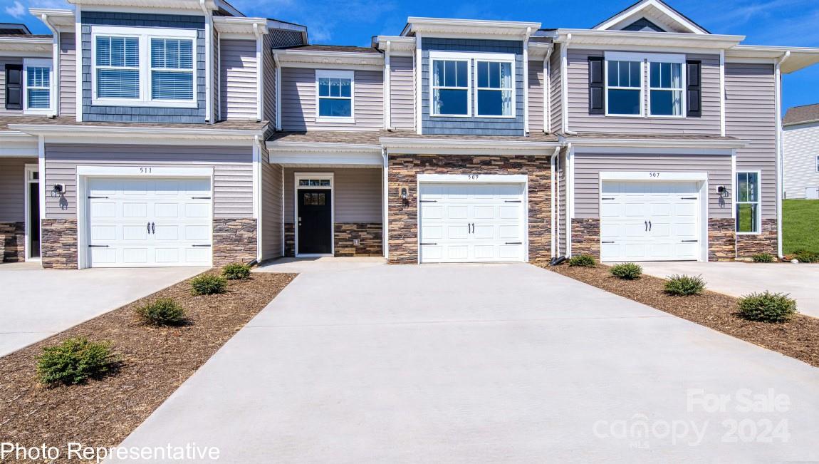 474 Wheatfield Road Fletcher, NC 28732 - Photo 1 of 45 a front view of a house with a yard