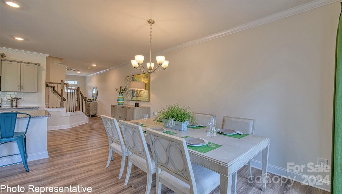 474 Wheatfield Road Fletcher, NC 28732 - Photo 21 of 45 a view of a dining room with furniture and wooden floor