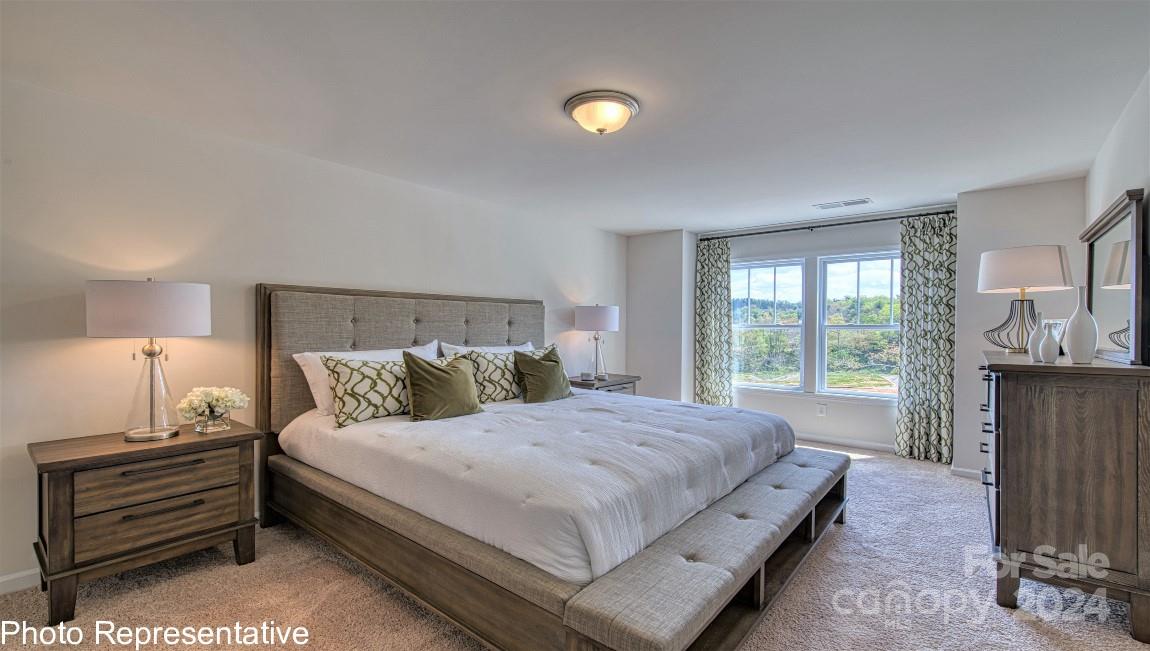 474 Wheatfield Road Fletcher, NC 28732 - Photo 26 of 45 a bedroom with a bed and a night stand