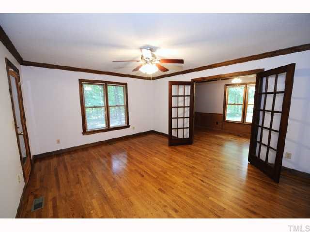 9265 Sauls Road Raleigh, NC 27603 - Photo 5 of 12 wooden floor in an empty room with a window