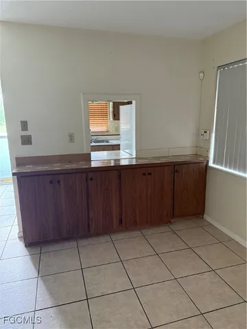 a kitchen with a cabinets and a window