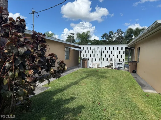 a view of a backyard of the house