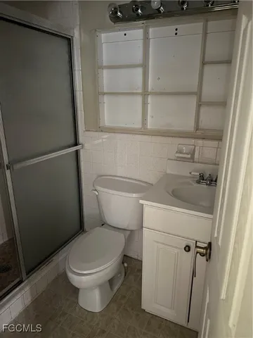 a bathroom with a toilet and a sink