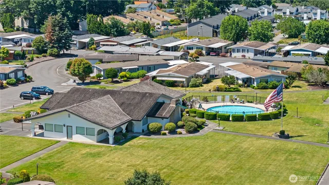 a view of a swimming pool with a yard