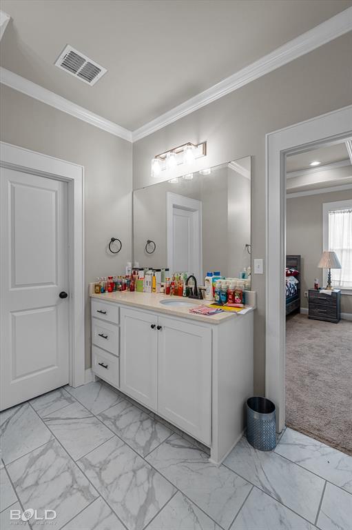 6896 Bethany Reed Circle Blanchard, LA 71107 - Photo 30 of 37 Bathroom vanity featuring a white cabinet, integrated sink, and light-toned countertop