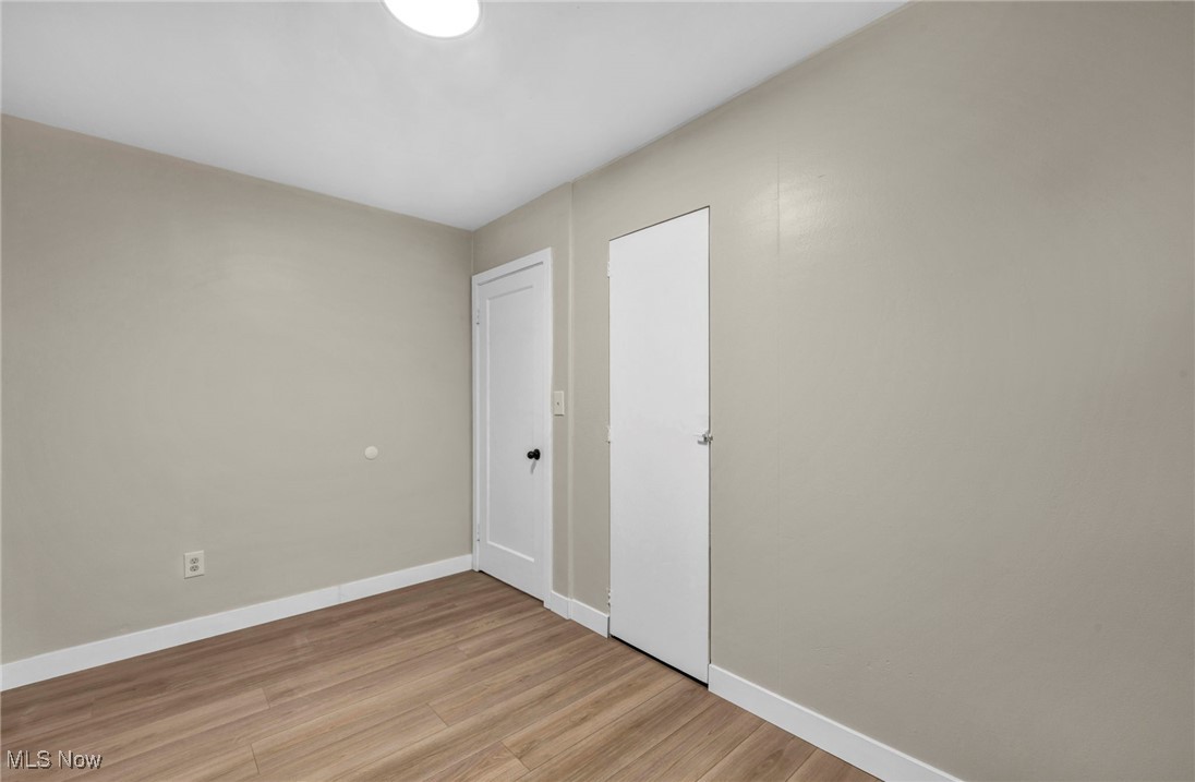 614 Weller Road Elyria, OH 44035 - Photo 34 of 39 Spare room featuring baseboards and light wood-style flooring
