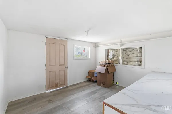 a kitchen with a refrigerator and a sink