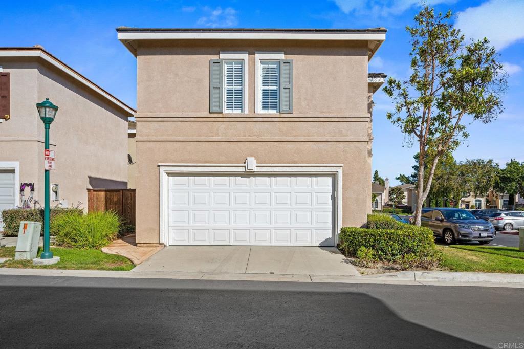 120 Venetia Way Oceanside, CA 92057 - Photo 23 of 32 a view of a house with a small garden