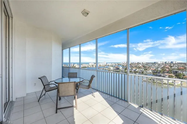 a view of a chair and table in the balcony