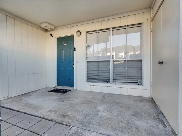 a view of empty room with sliding door