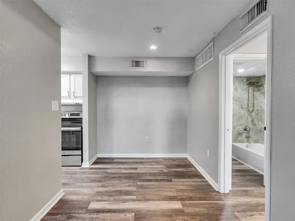 a view of a livingroom with wooden floor
