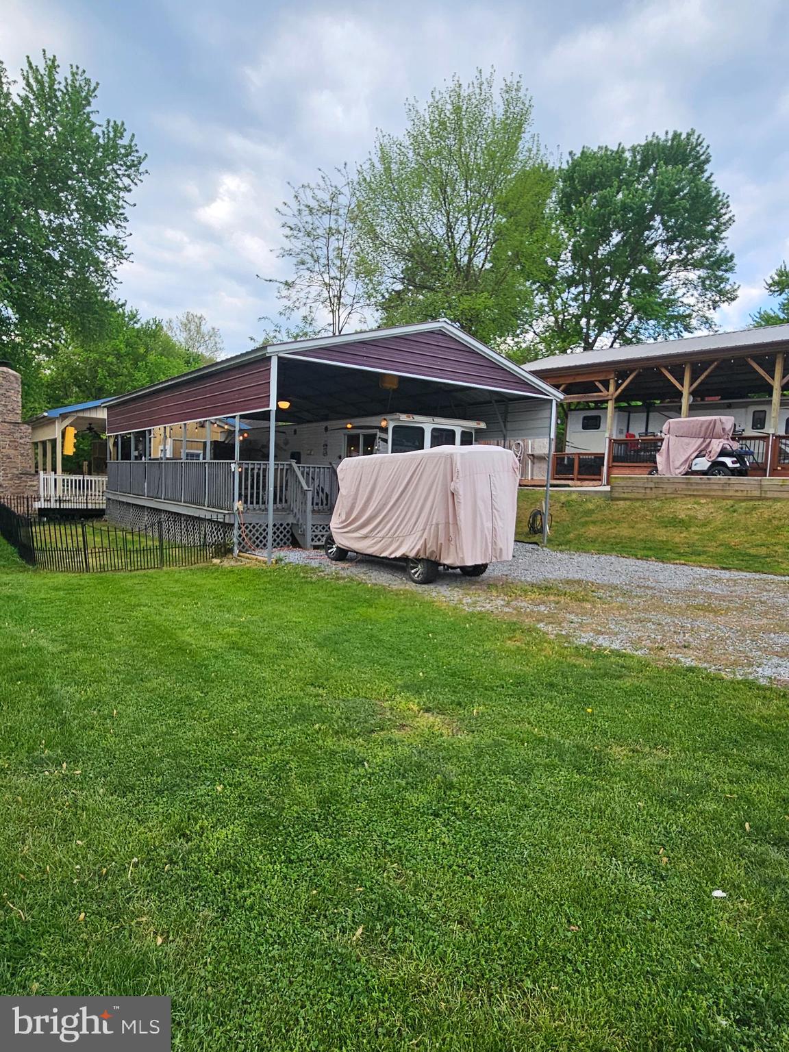 8 Cindy Avenue Falling Waters, WV 25419 - Photo 22 of 32 a view of a house with a yard deck and a large tree
