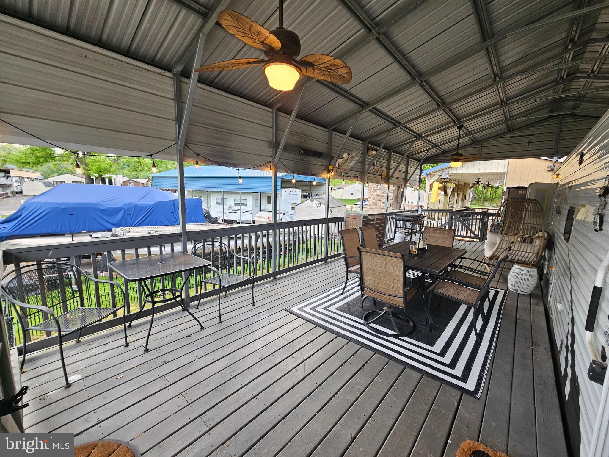 8 Cindy Avenue Falling Waters, WV 25419 - Photo 5 of 32 a view of a chairs and table in the balcony