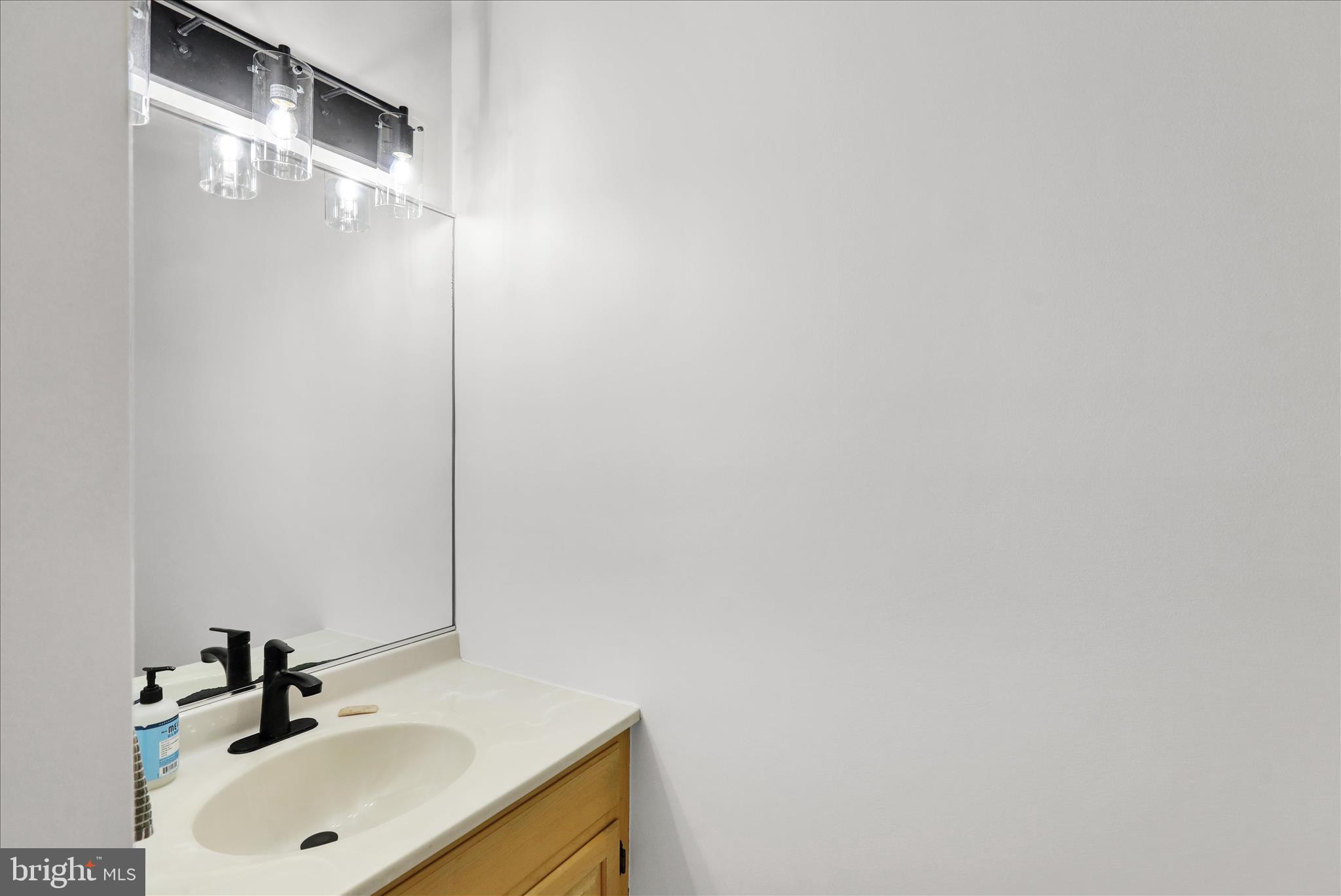 18 Colorado Avenue Reading, PA 19608 - Photo 17 of 37 a bathroom with a sink and a mirror
