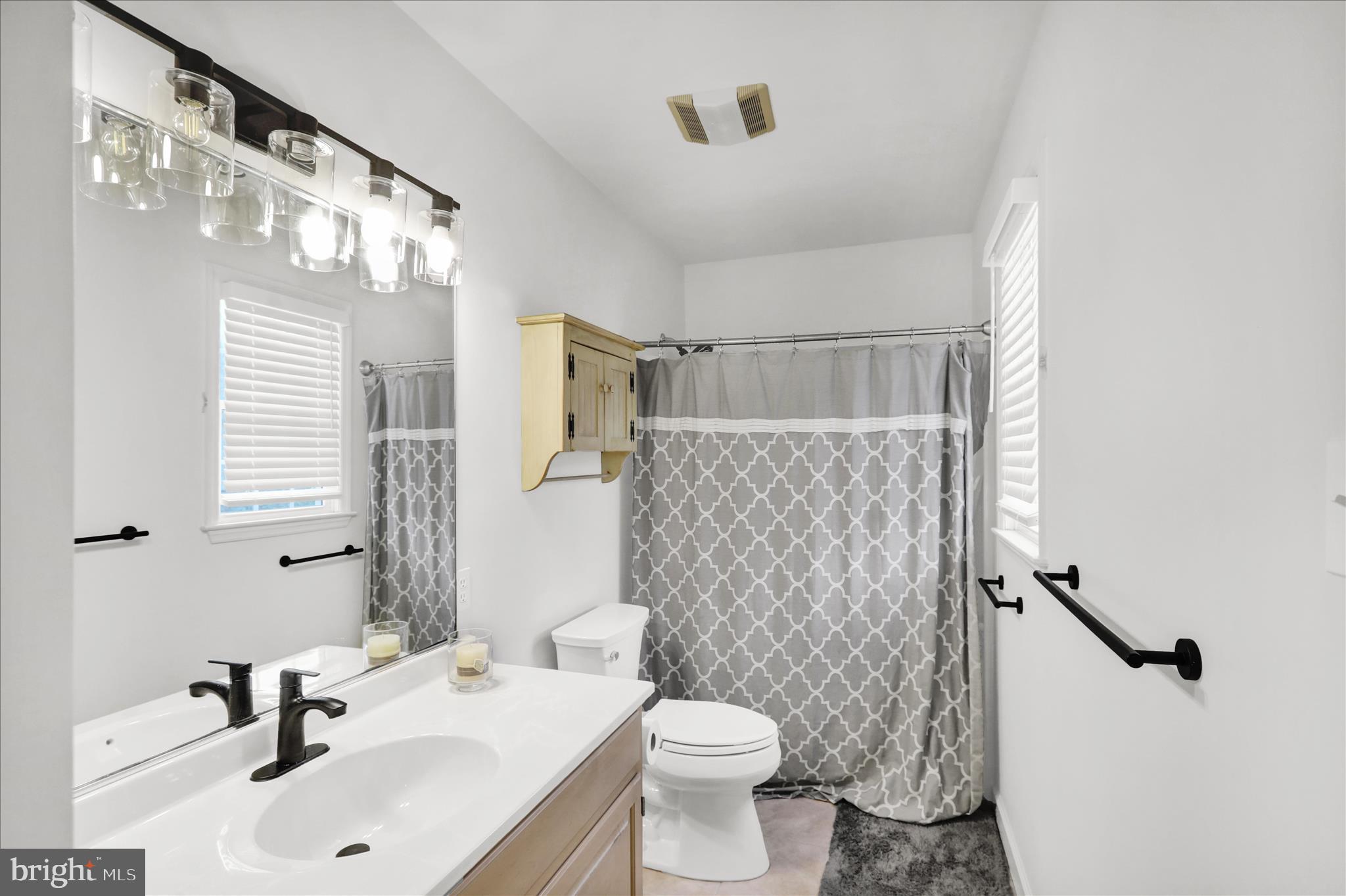 18 Colorado Avenue Reading, PA 19608 - Photo 26 of 37 a bathroom with a sink toilet mirror and shower