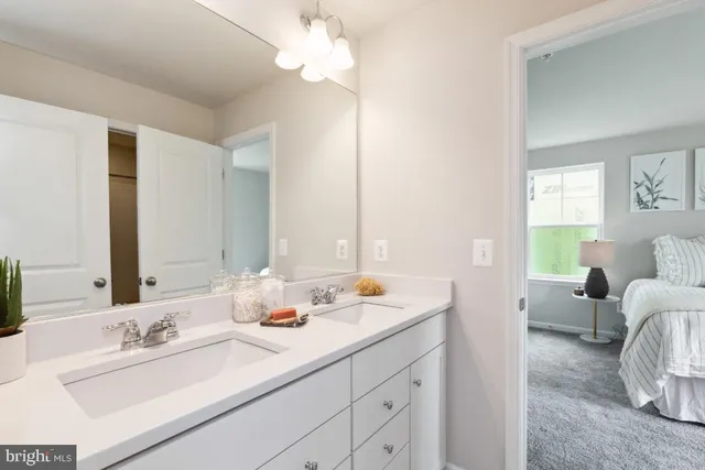 a bathroom with a double vanity sink and a mirror