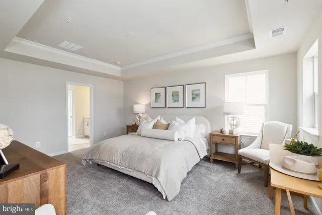 a bedroom with a bed and a couch