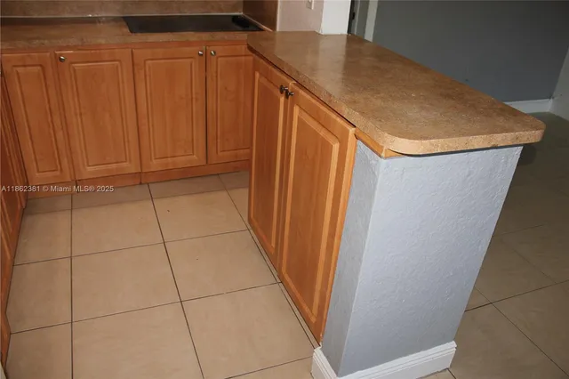 a view of a garden with a house