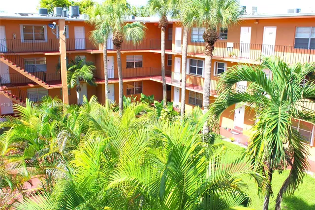a view of a garden with a building in front of the house