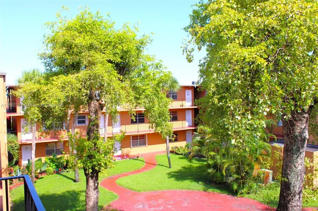 a view of a building with a yard