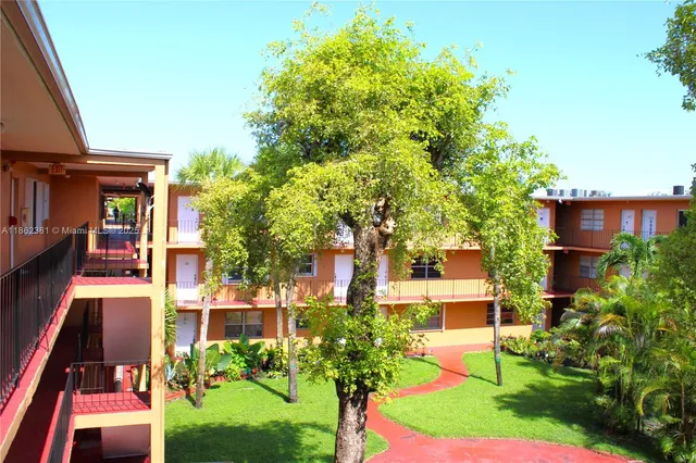 a view of a building with a yard