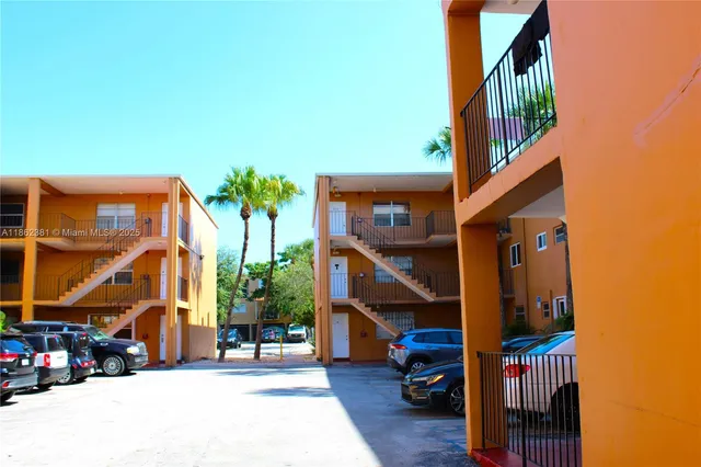a view of street with parked cars