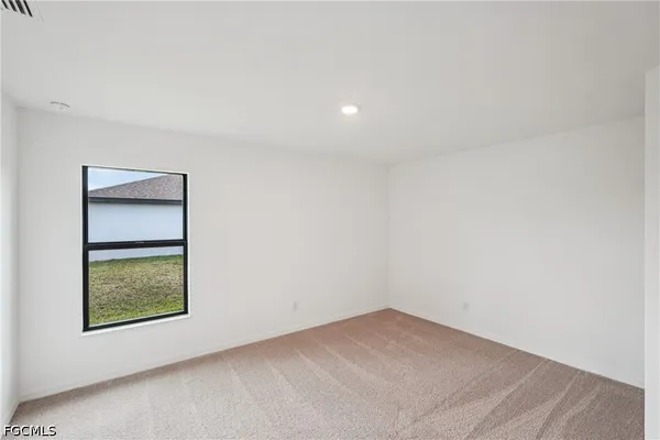 an aerial view of a house with a ocean view