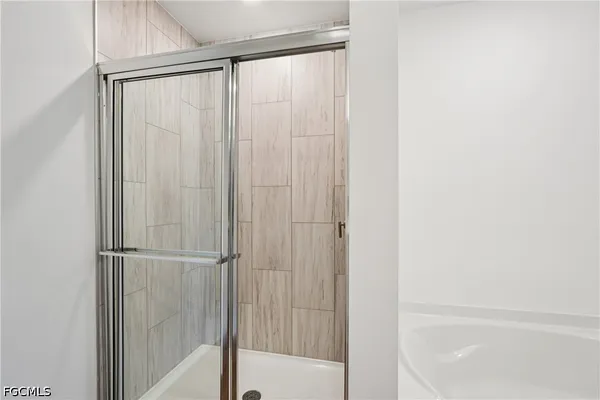 an aerial view of residential houses with outdoor space and river