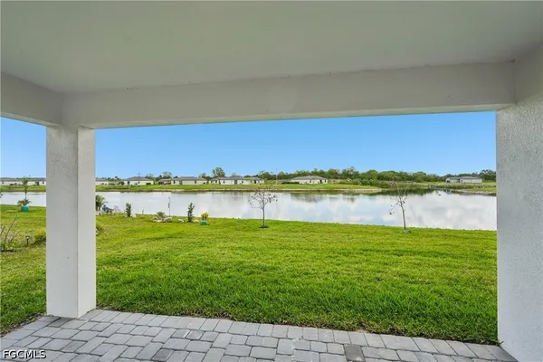 a view of a house with a yard and garage