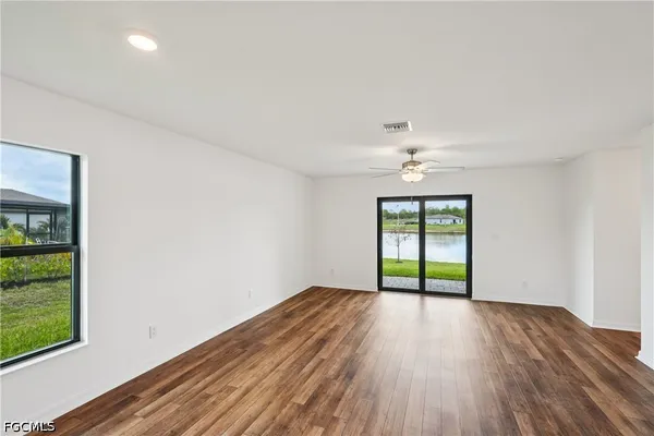 a kitchen with granite countertop stainless steel appliances and wooden cabinets