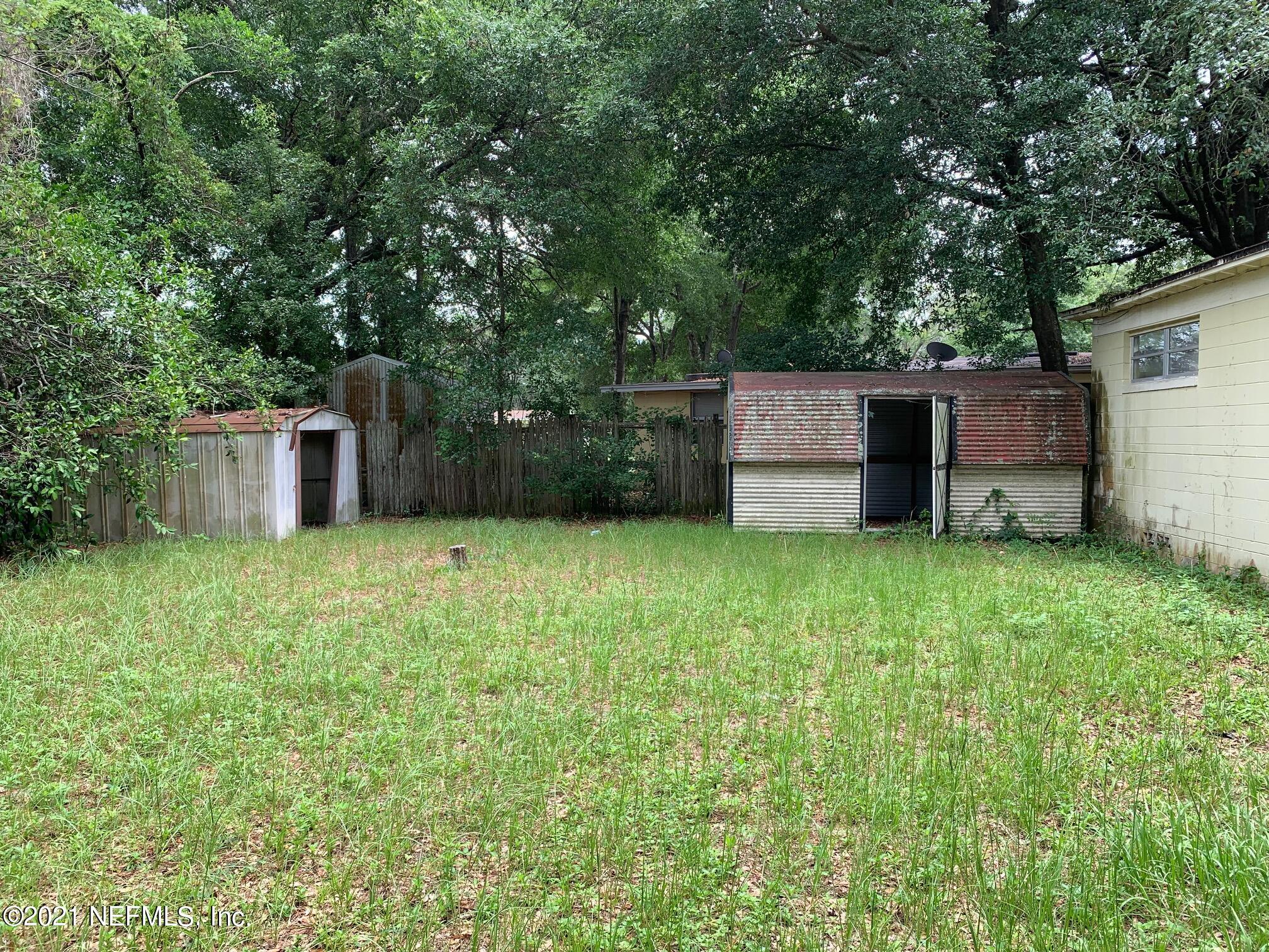 2619 Bywood Road Jacksonville, FL 32211 - Photo 13 of 13 a backyard of a house with lots of green space