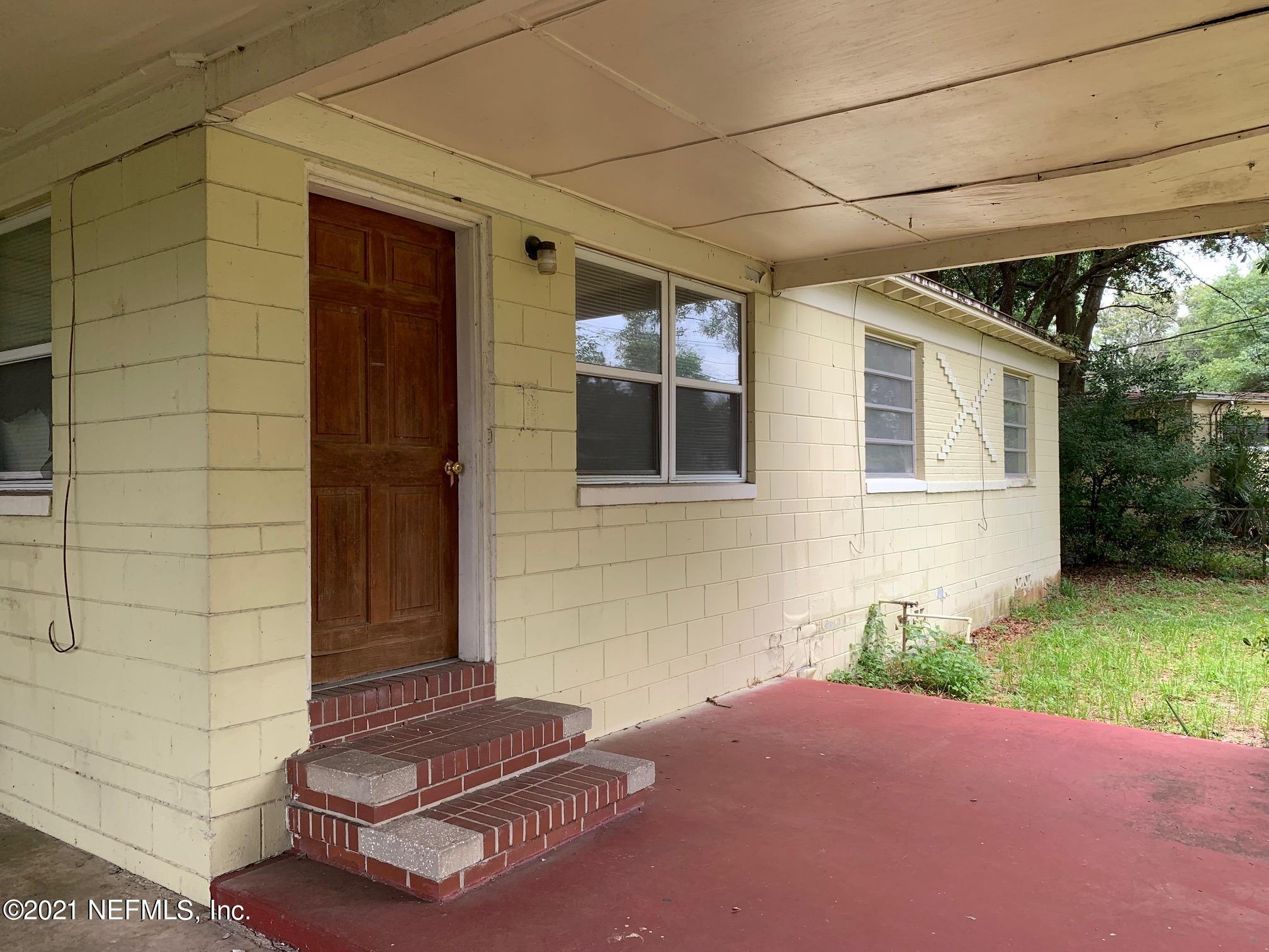 2619 Bywood Road Jacksonville, FL 32211 - Photo 2 of 13 a couple of potted plants in front of door