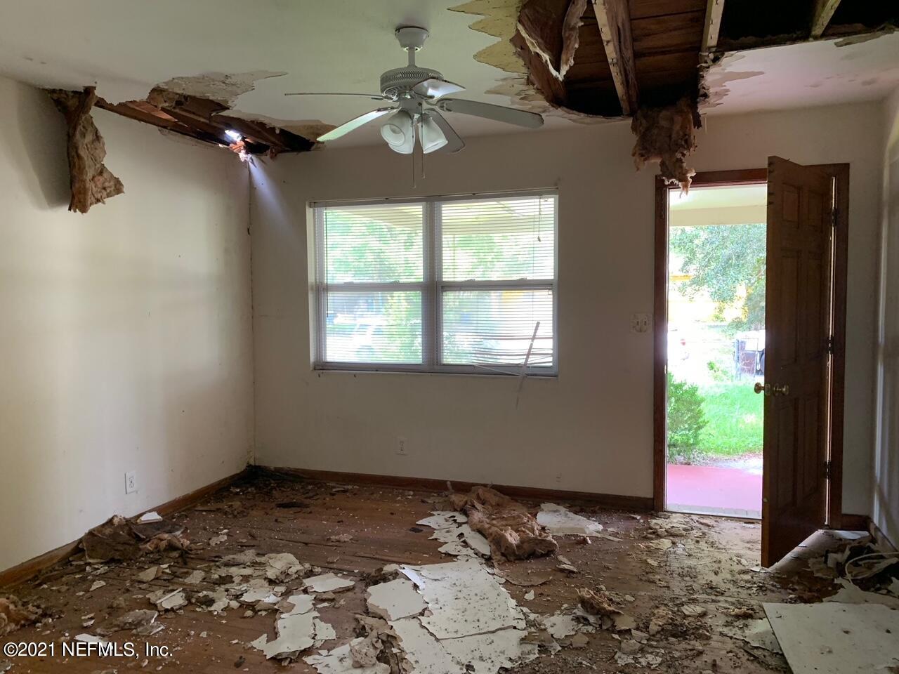 2619 Bywood Road Jacksonville, FL 32211 - Photo 6 of 13 a view of a bedroom with a large bed and a window