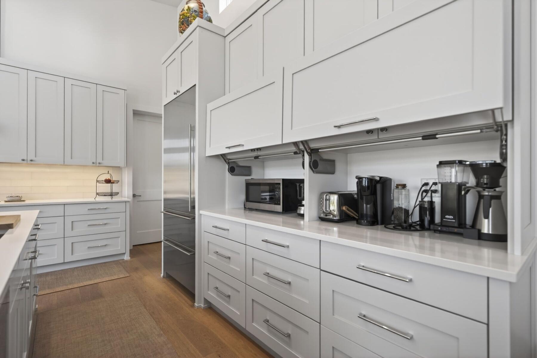 61487 Hackleman Court Bend, OR 97702 - Photo 11 of 35 a kitchen with granite countertop cabinets and stainless steel appliances