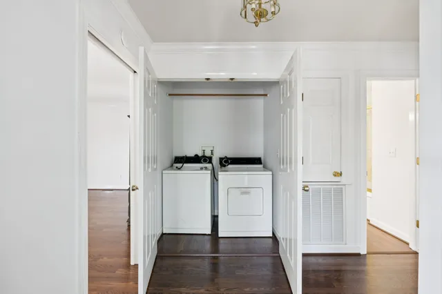 a view of walk in closet with white walls
