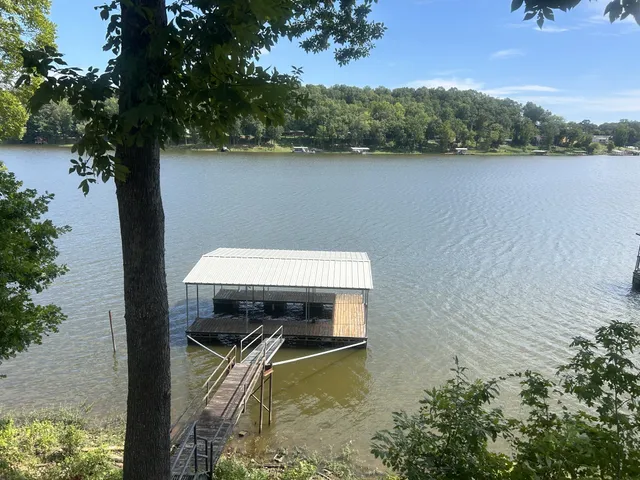 a small pool with a mountain in the background