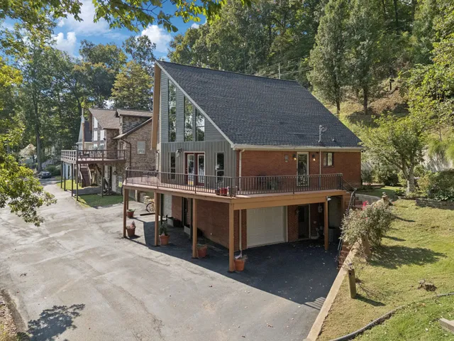 a view of house with outdoor seating area