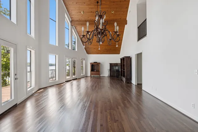 a view of an entryway with wooden floor