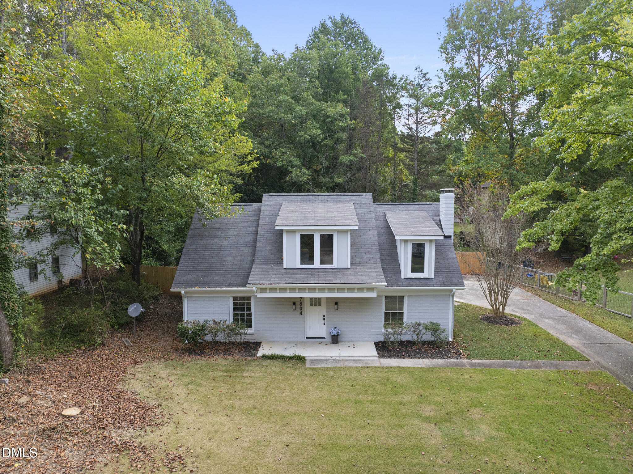7804 Brandyapple Drive Raleigh, NC 27615 - Photo 3 of 58 front view of a house with a yard