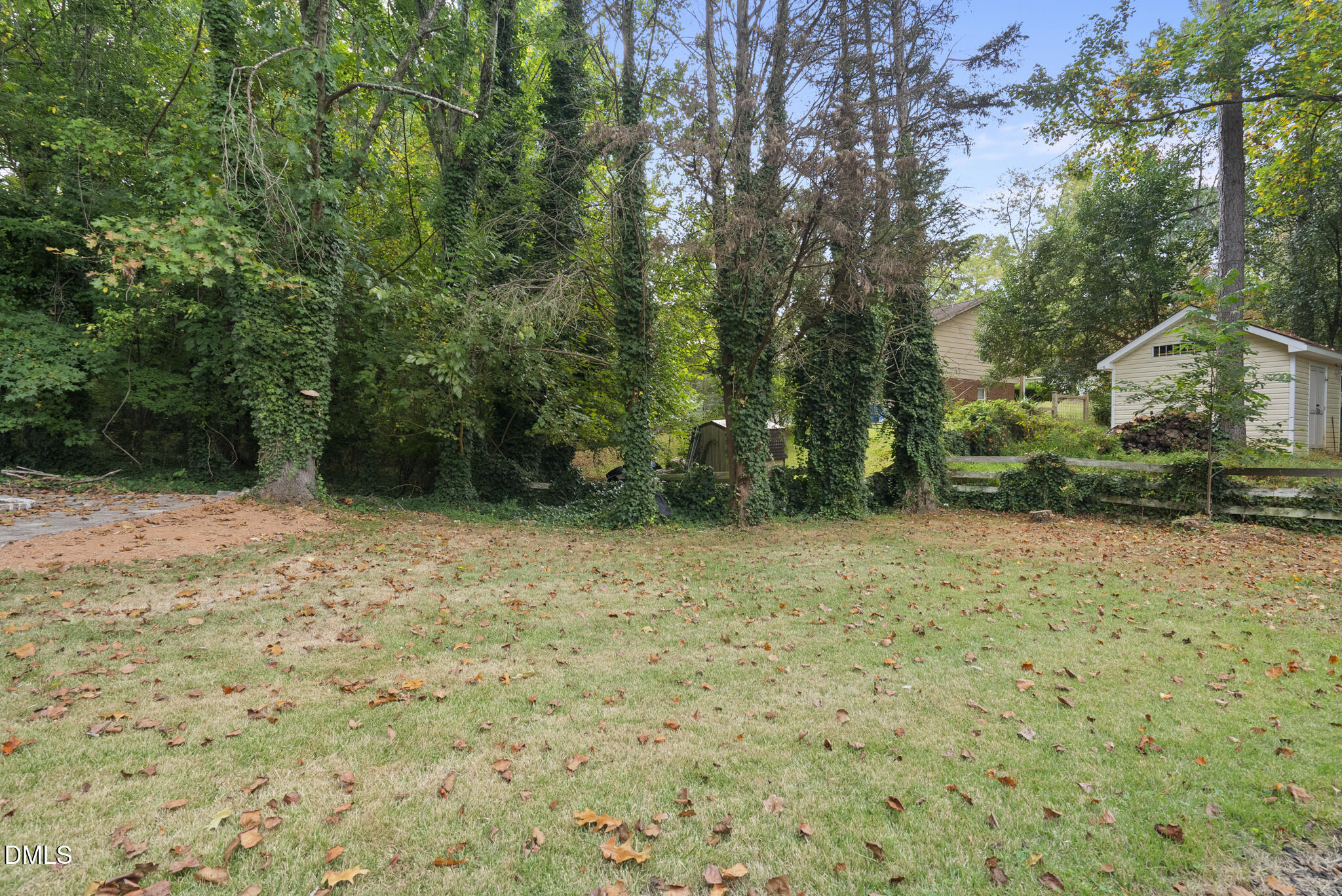 7804 Brandyapple Drive Raleigh, NC 27615 - Photo 53 of 58 a backyard of a house with lots of green space